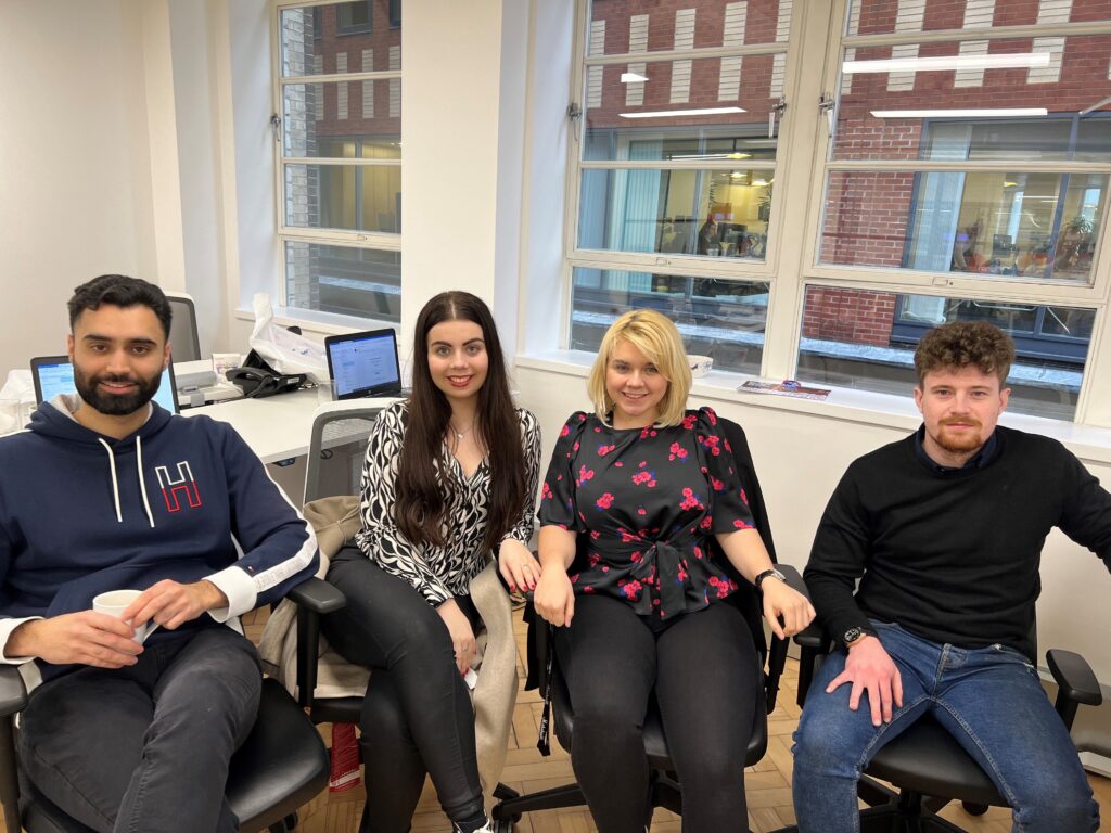 A group of people sitting in chairs