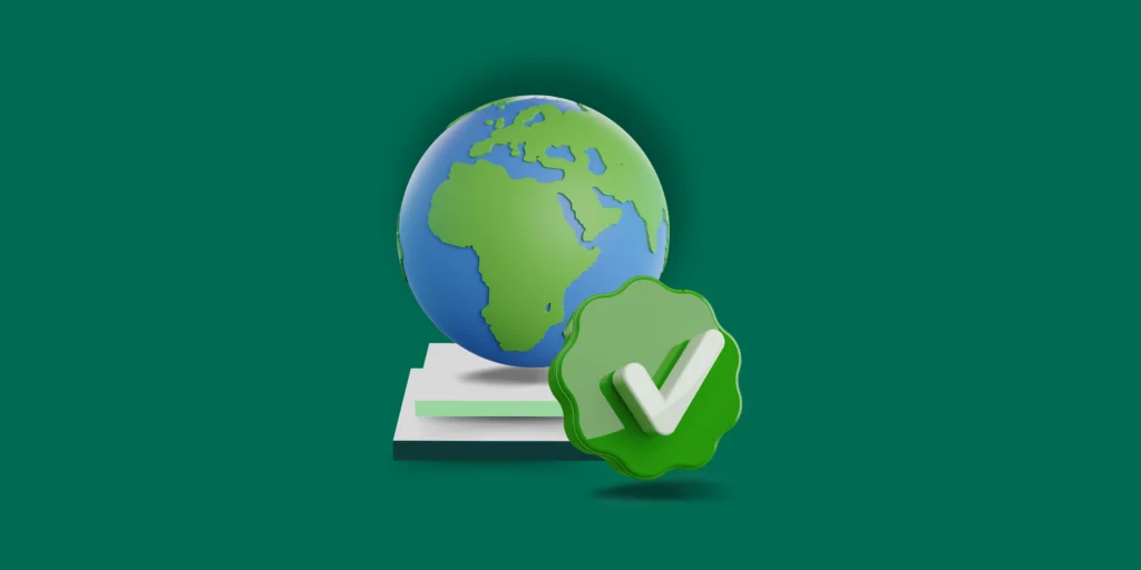 A 3D styled globe of the Earth sits on a pedestal besides a green badge with a white tick or checkmark inside.