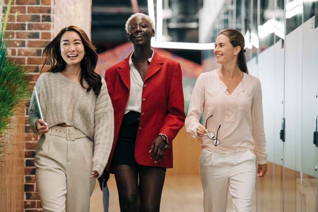 A group of people walking down a hallway