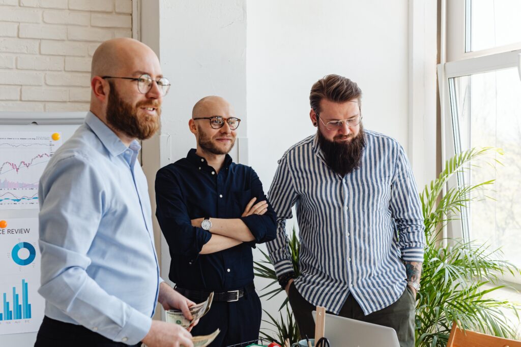 A group of men standing in a room