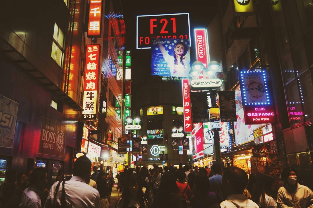 A first person view of walking down the neon lit streets of Shibuya, Tokyo