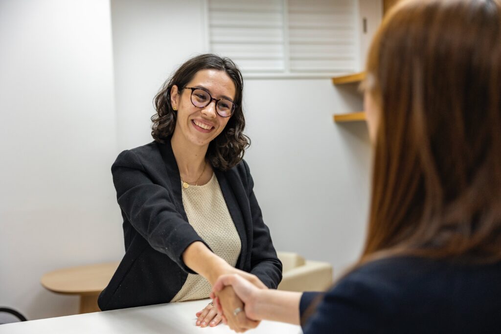 Two business people shaking hands