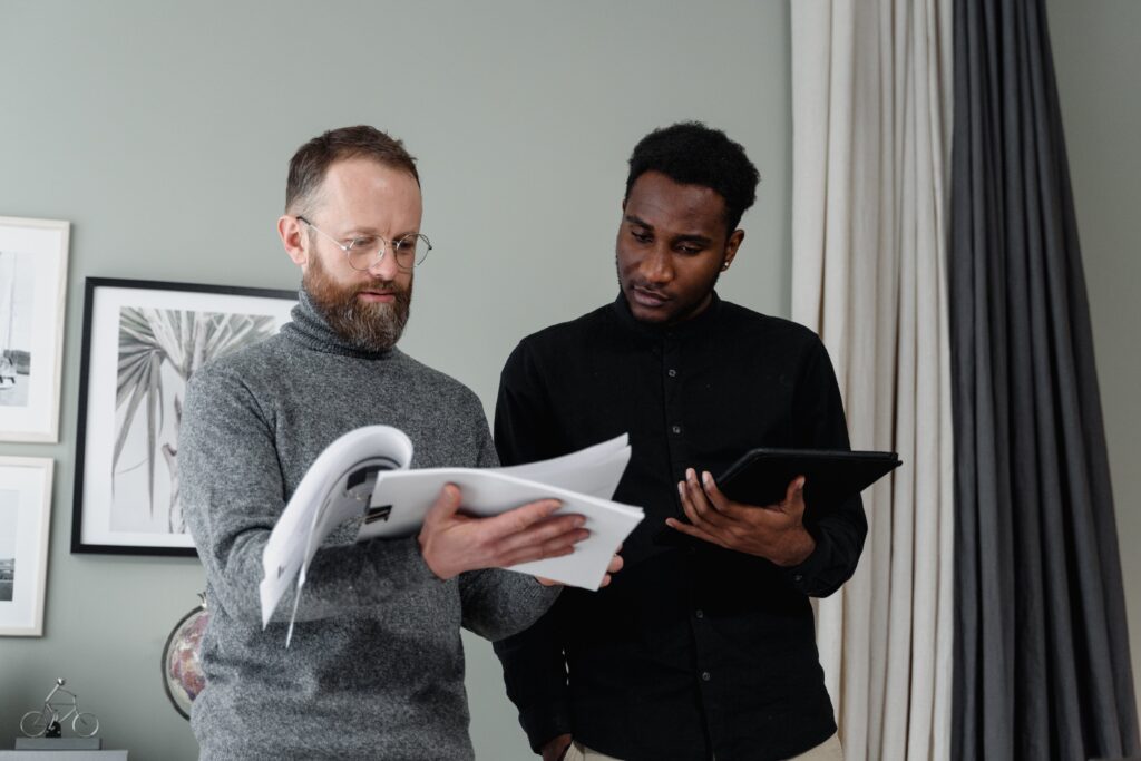 Two business men reviewing papers