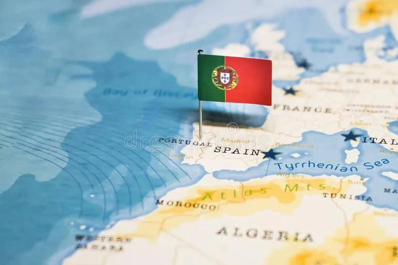 A flag pin of Portugal on a map