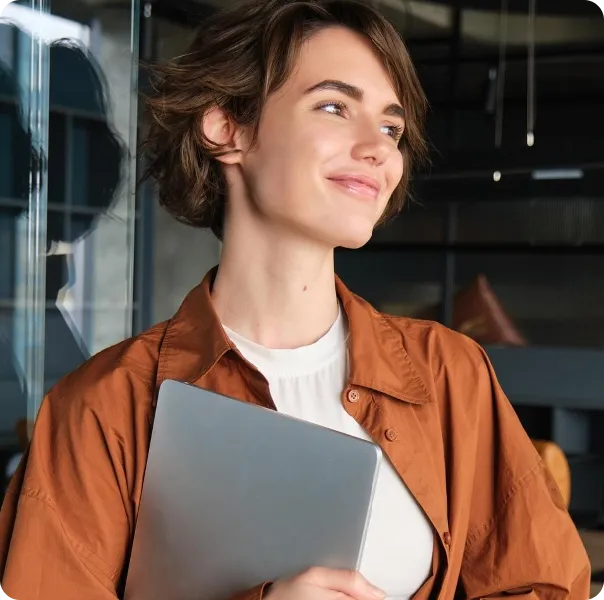 Woman Holding Laptop Smiling